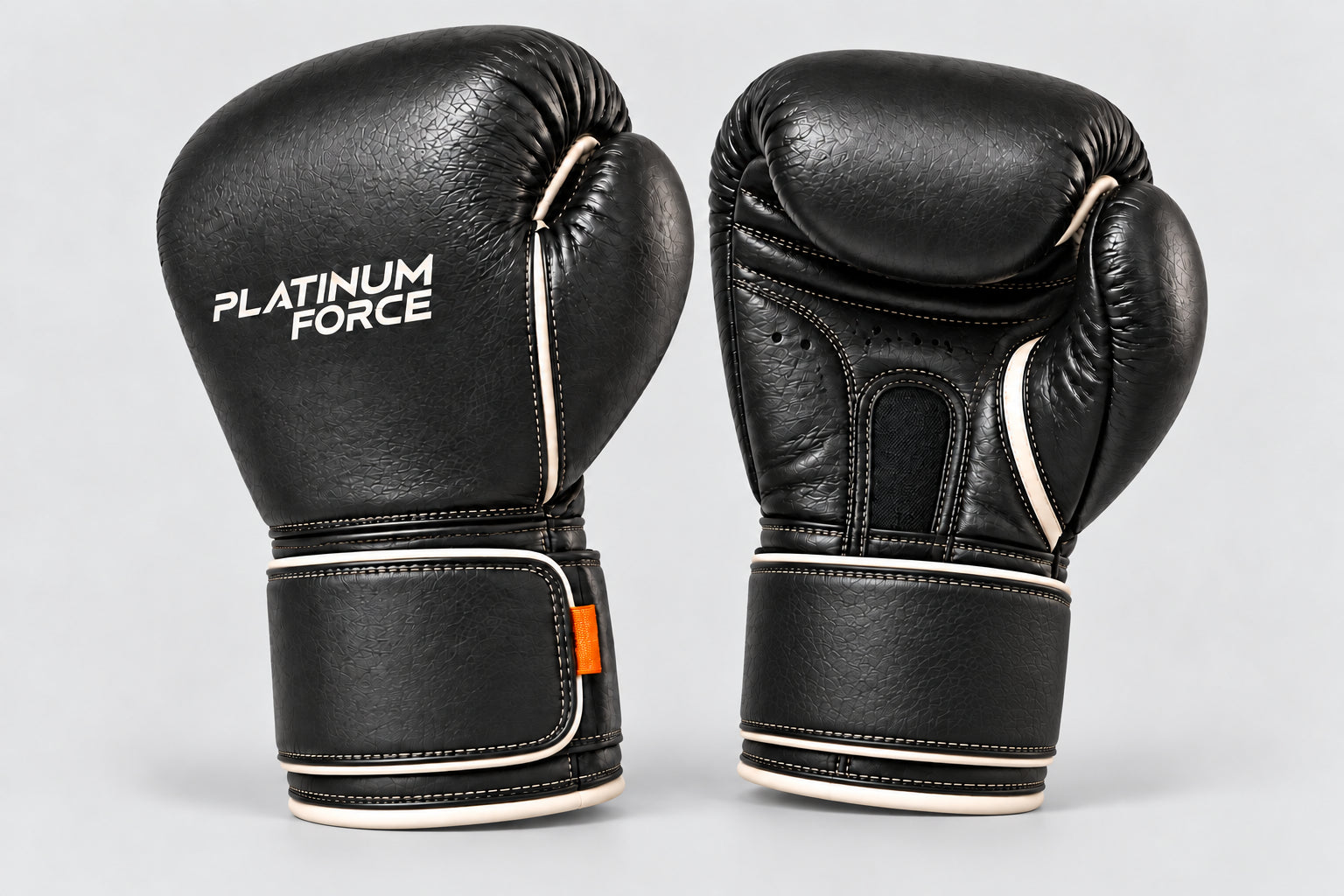 Black Platinum Force training gloves with a rounded knuckle, broad wrist strap, ivory trim and orange tabs